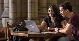 two students studying together in Cathedral of Learning Commons Room